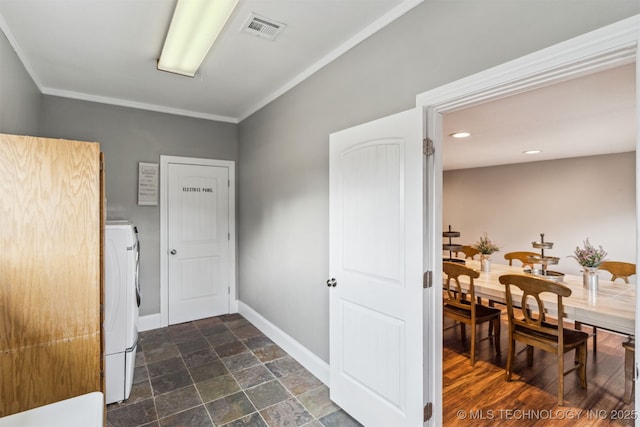 interior space with crown molding and washer / dryer