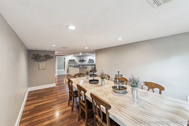 dining space featuring dark hardwood / wood-style floors