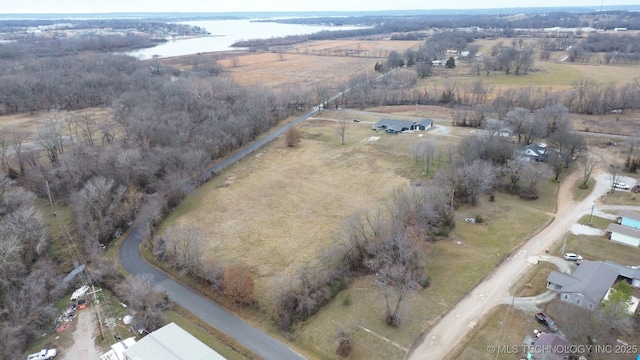 drone / aerial view with a rural view and a water view