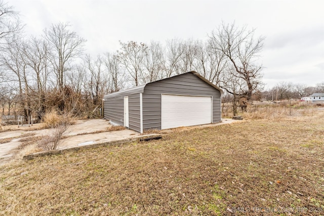 garage with a yard