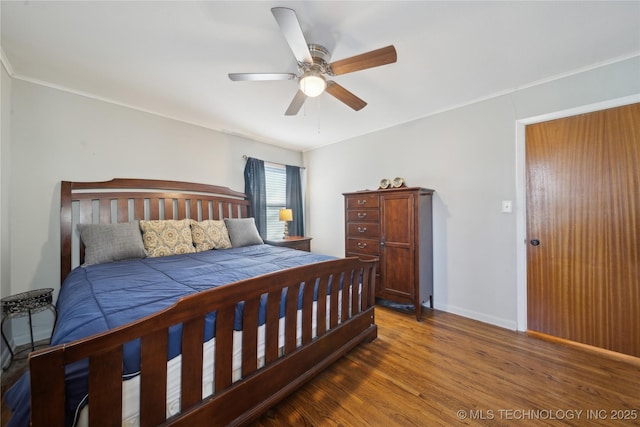 bedroom featuring dark hardwood / wood-style floors and ceiling fan