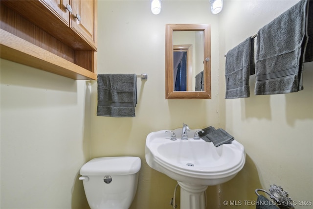 bathroom with sink and toilet