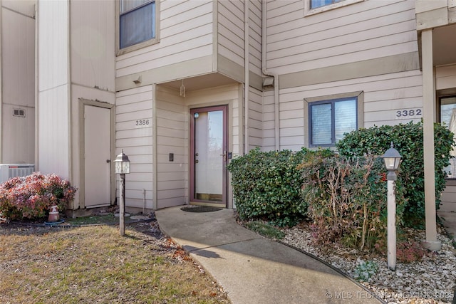 doorway to property with central air condition unit