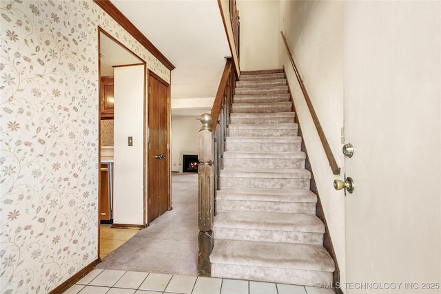 stairs with crown molding