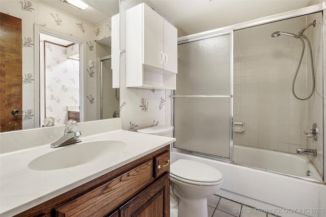 full bathroom with toilet, vanity, shower / bath combination with glass door, and tile patterned flooring