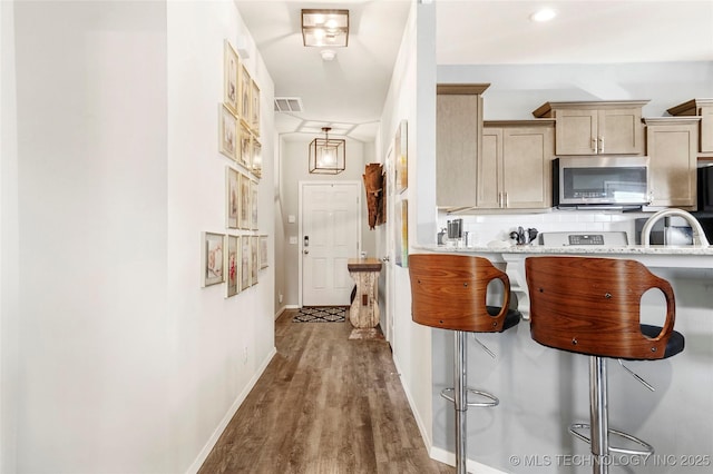 hallway featuring dark hardwood / wood-style flooring and sink