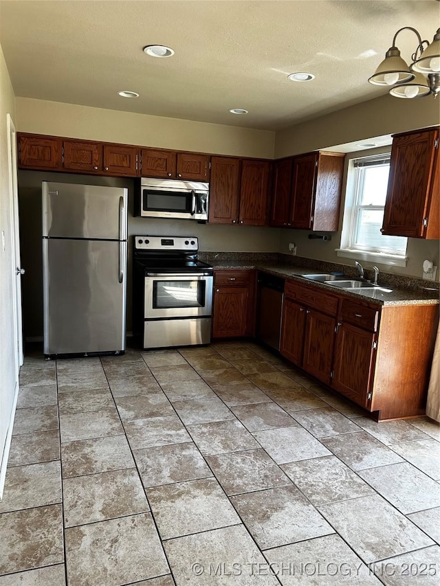 kitchen with appliances with stainless steel finishes and sink