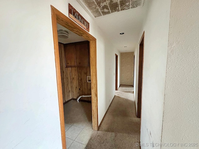 corridor with light tile patterned floors