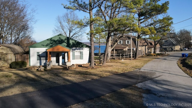 view of front of house with a water view