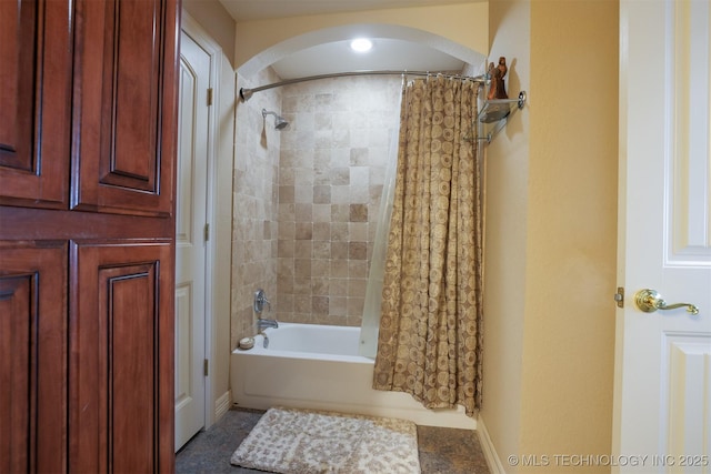 bathroom with shower / tub combo with curtain