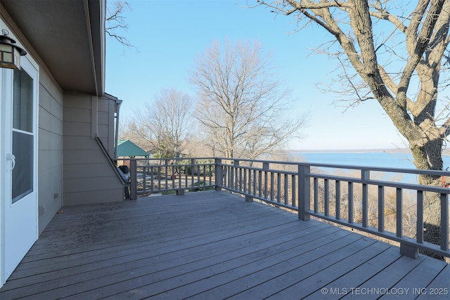 deck featuring a water view and a view of the beach