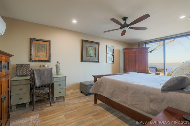 bedroom featuring light hardwood / wood-style floors and ceiling fan