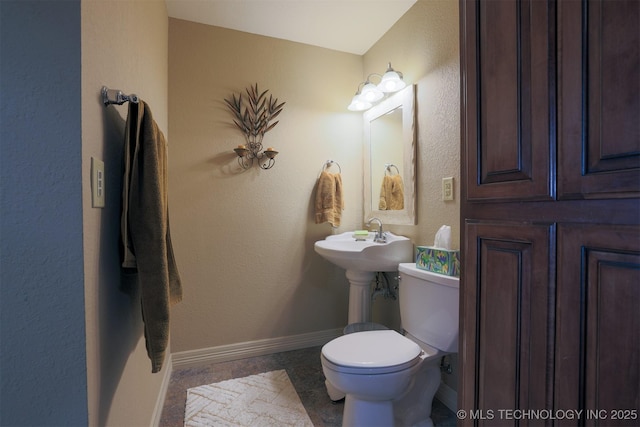 bathroom featuring sink and toilet