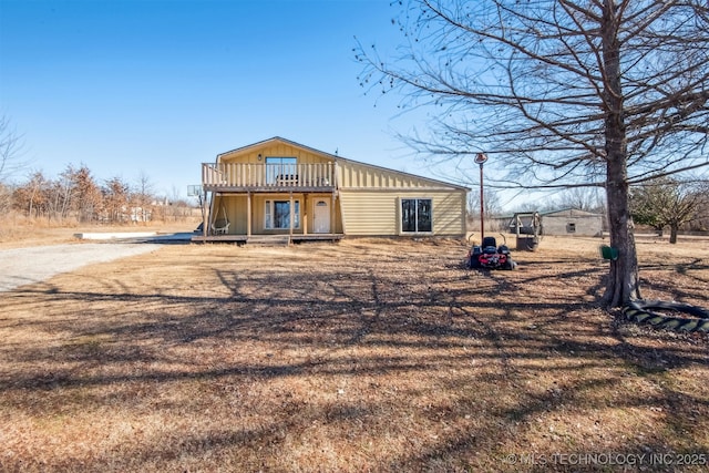 back of house featuring a deck