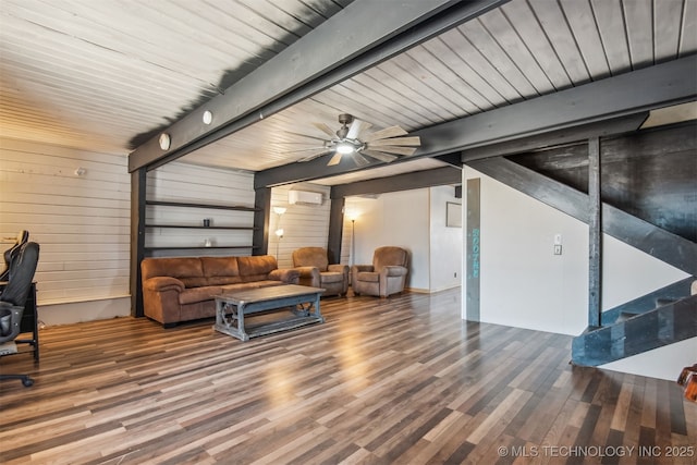 living room with beam ceiling, wood-type flooring, and ceiling fan