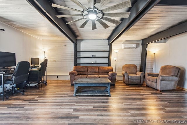 interior space with ceiling fan, wood-type flooring, beam ceiling, and a wall mounted air conditioner