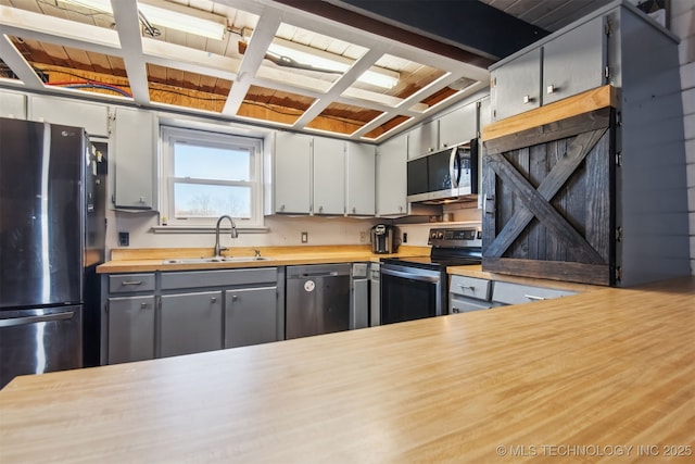 kitchen with gray cabinetry, sink, and black appliances