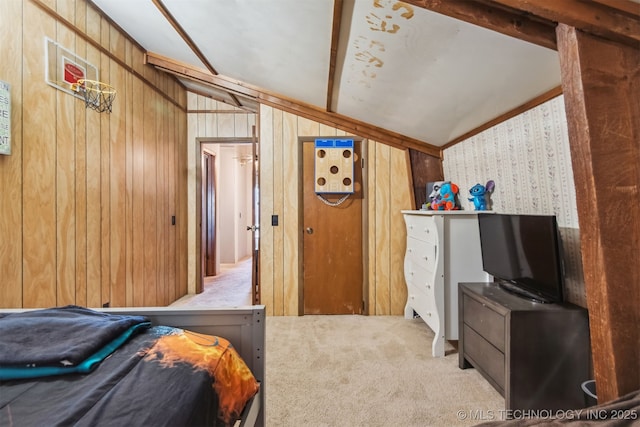 carpeted bedroom with lofted ceiling with beams and wooden walls