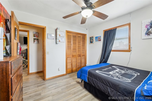 bedroom with ceiling fan, a closet, and light wood-type flooring