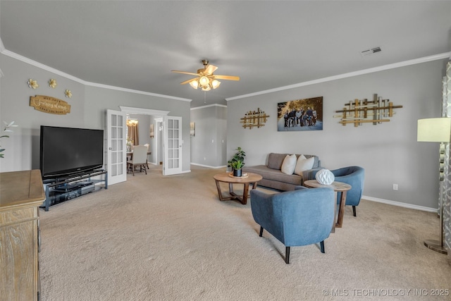 carpeted living room with crown molding, ceiling fan, and french doors