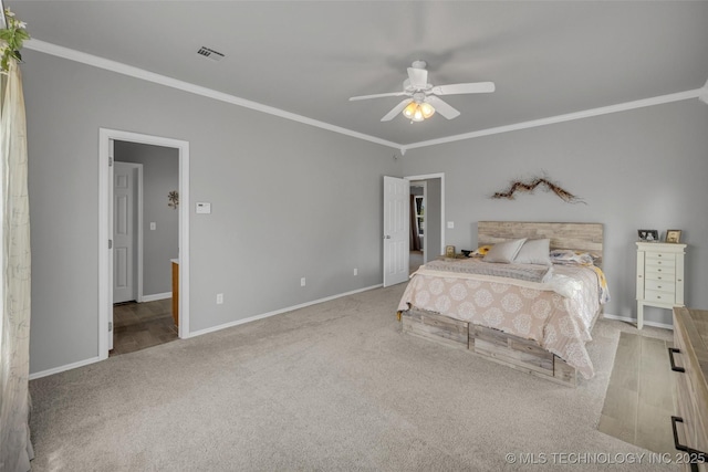 bedroom with ornamental molding, ceiling fan, and carpet flooring