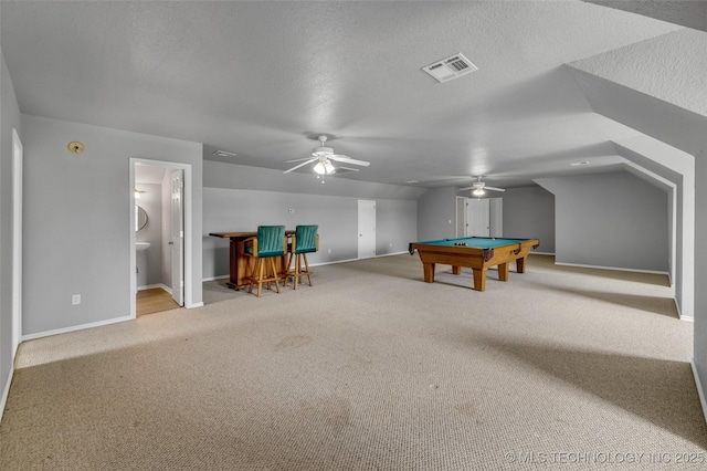 game room with light carpet, lofted ceiling, a textured ceiling, and billiards