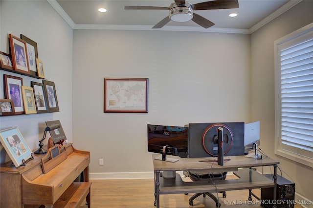 office space featuring ceiling fan, ornamental molding, and light wood-type flooring