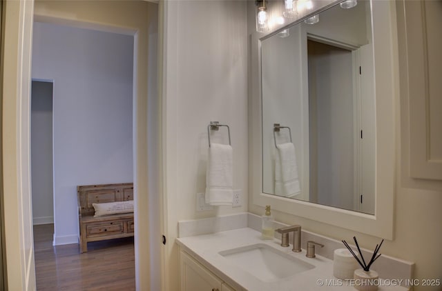 bathroom with vanity and wood-type flooring