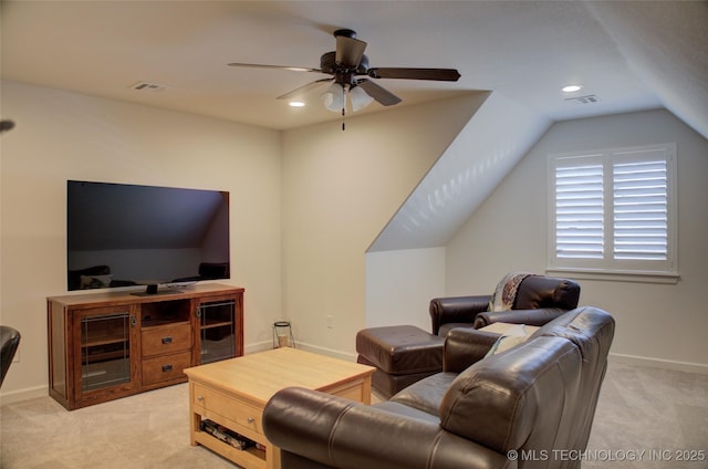 carpeted living room featuring ceiling fan and lofted ceiling