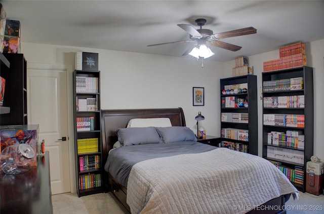 bedroom featuring light colored carpet and ceiling fan