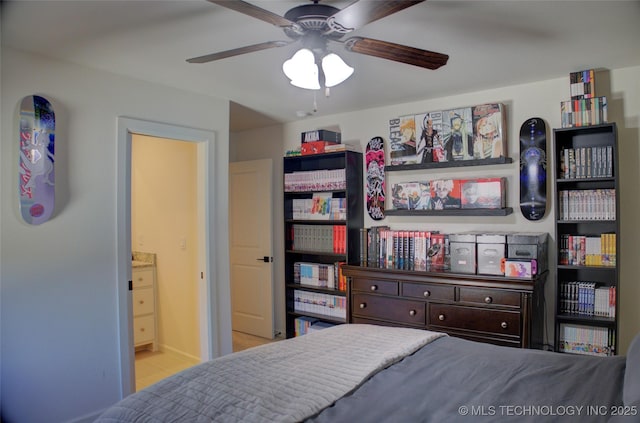 bedroom with ceiling fan and connected bathroom