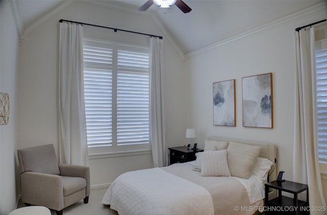 bedroom with crown molding, vaulted ceiling, ceiling fan, and carpet flooring