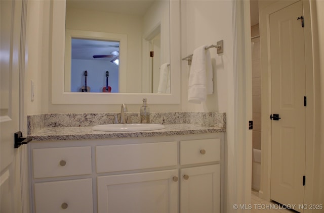 bathroom featuring ceiling fan and vanity