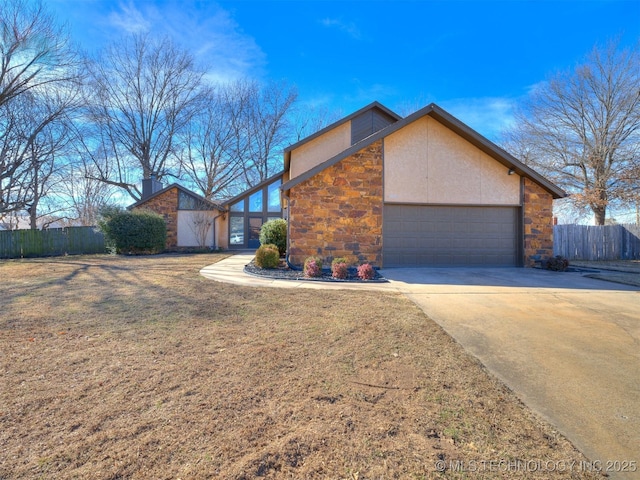 view of side of property featuring a yard and a garage