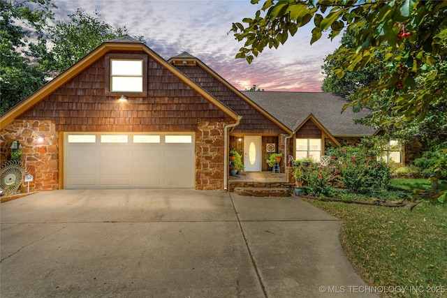4413 Quail Run, Skiatook, OK 74070 - view of front facade with stone siding, concrete driveway, and an attached garage