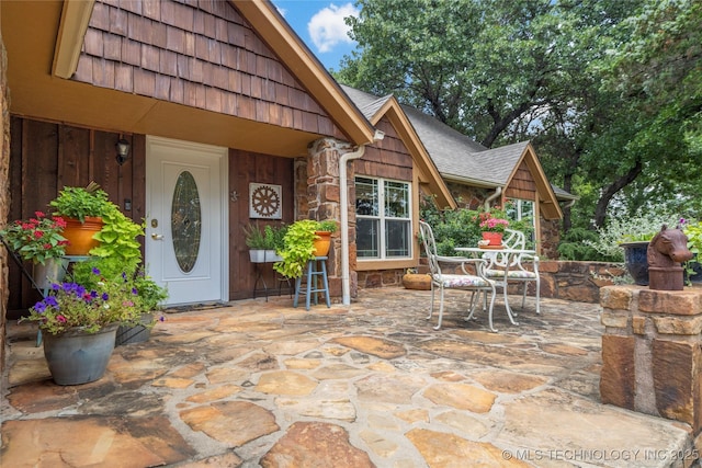 entrance to property featuring a patio