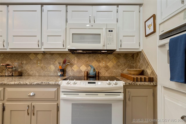 kitchen featuring light stone counters, white appliances, white cabinetry, and tasteful backsplash