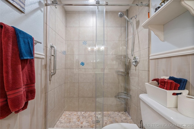 bathroom with toilet and walk in shower