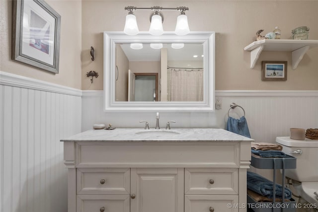 bathroom with vanity and toilet