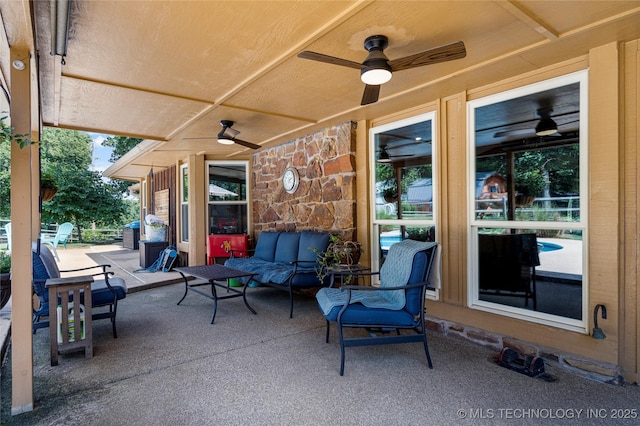 view of patio featuring ceiling fan