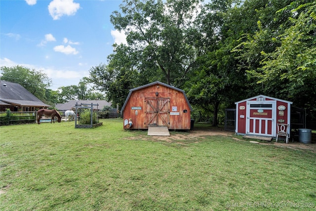 view of outdoor structure with a lawn