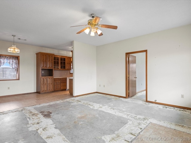 unfurnished living room with ceiling fan