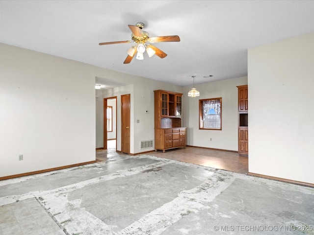 unfurnished living room with ceiling fan