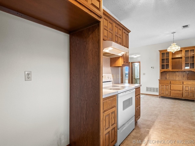 kitchen with pendant lighting, a textured ceiling, and white range with electric cooktop