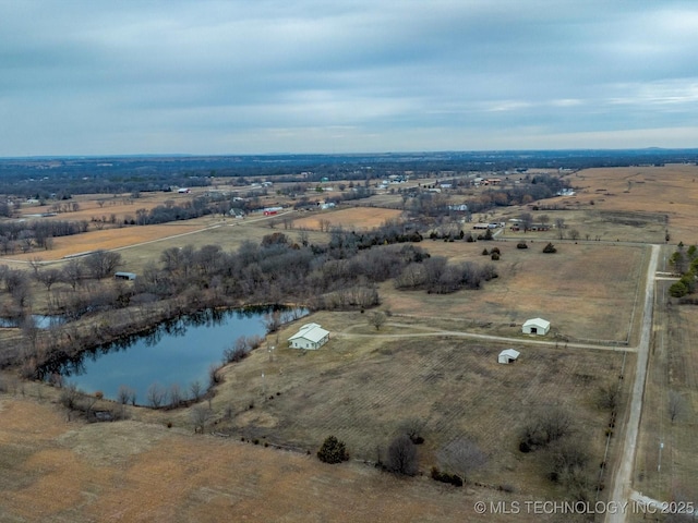 birds eye view of property with a rural view and a water view