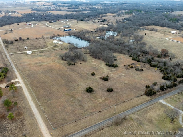 aerial view with a rural view and a water view