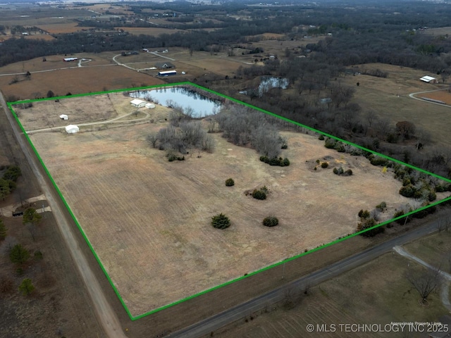 drone / aerial view featuring a rural view and a water view