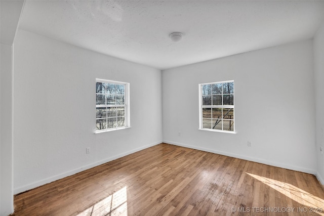 empty room featuring hardwood / wood-style flooring