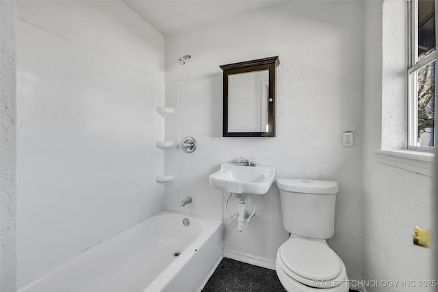 full bathroom featuring bathtub / shower combination, toilet, and sink