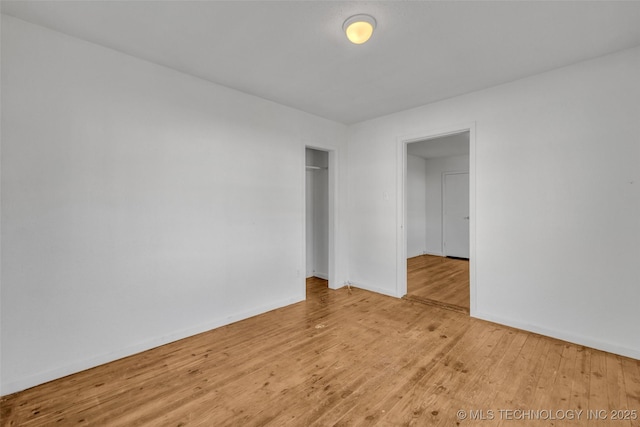 spare room with light hardwood / wood-style floors